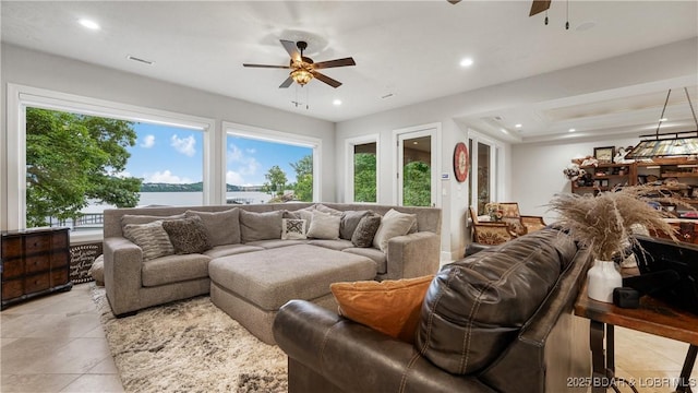 1453 Grand View Dr, Porto Cima, MO 65079 - living room featuring a ceiling fan, light tile patterned floors, recessed lighting, and a water view