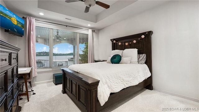 1453 Grand View Dr, Porto Cima, MO 65079 - bedroom featuring recessed lighting, a ceiling fan, a raised ceiling, and light colored carpet