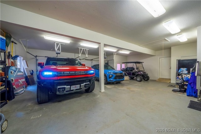 1453 Grand View Dr, Porto Cima, MO 65079 - garage with a garage door opener