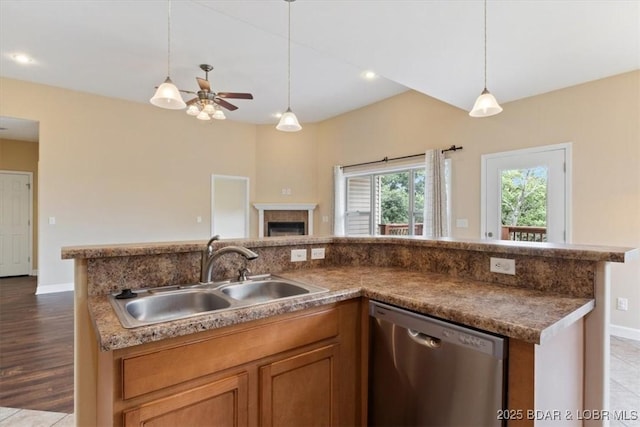267 Cornett Branch Rd, Four Seasons, MO 65049 - kitchen with dishwasher, open floor plan, pendant lighting, a ceiling fan, and brown cabinetry