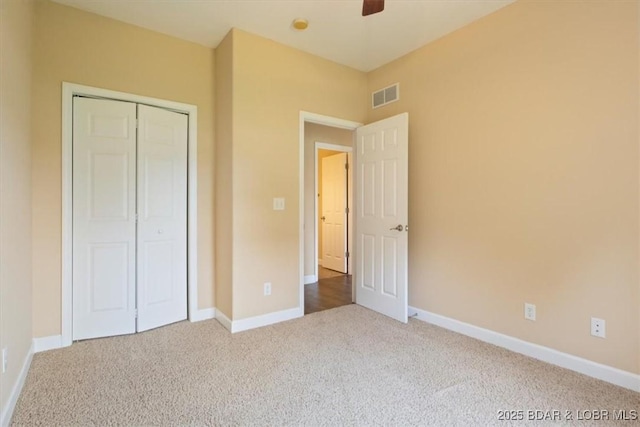 267 Cornett Branch Rd, Four Seasons, MO 65049 - unfurnished bedroom with carpet flooring, a closet, and a ceiling fan