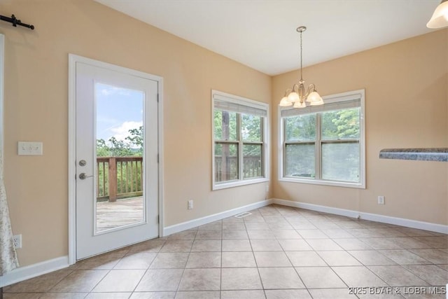 267 Cornett Branch Rd, Four Seasons, MO 65049 - unfurnished dining area with a chandelier and light tile patterned flooring