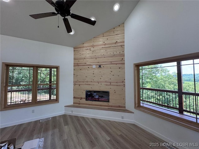 1378 Full Gallop Ln, Roach, MO 65787 - unfurnished living room with high vaulted ceiling, wood finished floors, healthy amount of natural light, a fireplace, and ceiling fan