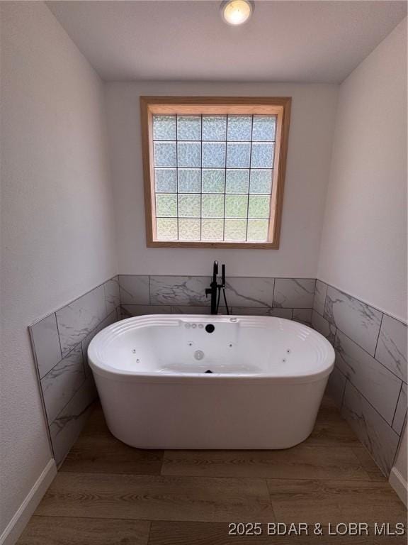 1378 Full Gallop Ln, Roach, MO 65787 - full bath featuring a soaking tub and wood finished floors