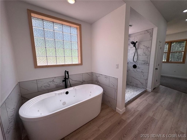 1378 Full Gallop Ln, Roach, MO 65787 - full bath featuring wood finished floors, a freestanding bath, a tile shower, and recessed lighting