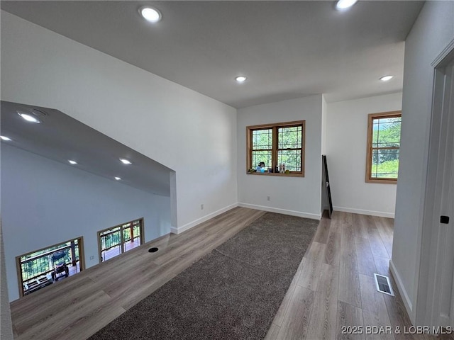 1378 Full Gallop Ln, Roach, MO 65787 - unfurnished living room with wood finished floors, recessed lighting, and plenty of natural light