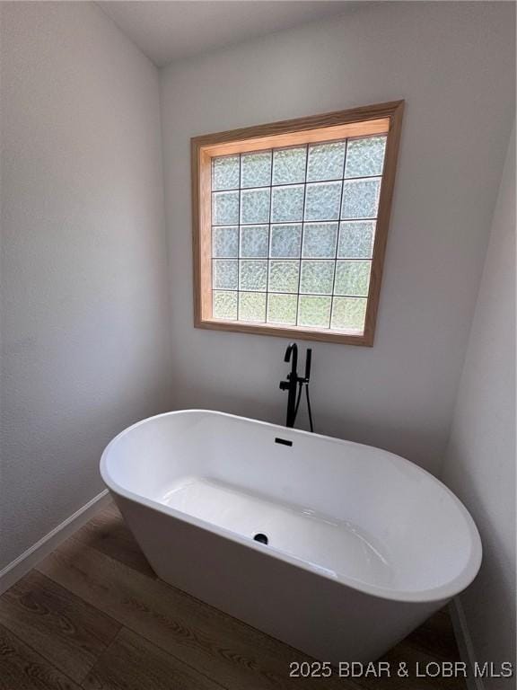 1378 Full Gallop Ln, Roach, MO 65787 - full bathroom featuring wood finished floors and a freestanding bath