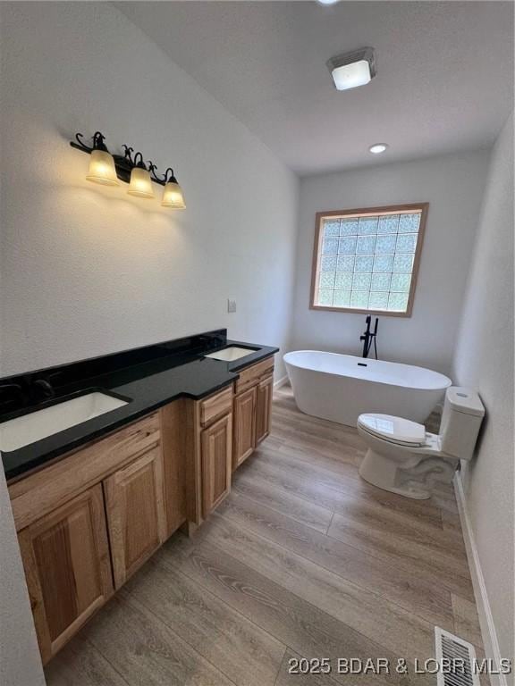 1378 Full Gallop Ln, Roach, MO 65787 - bathroom featuring wood finished floors and a soaking tub