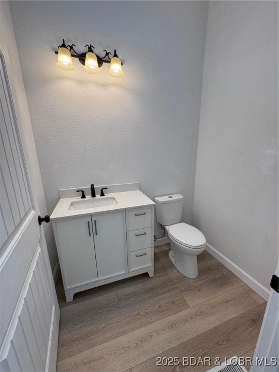 1378 Full Gallop Ln, Roach, MO 65787 - half bath with vanity and wood finished floors