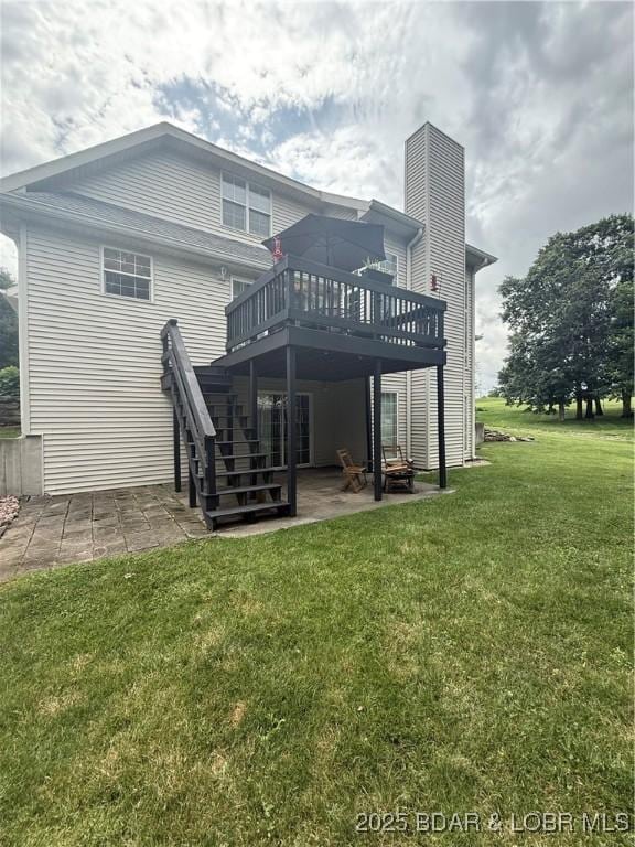 1720 Lakeview Dr, Chillicothe, MO 64601 - back of property with a patio, a deck, a yard, stairs, and a chimney