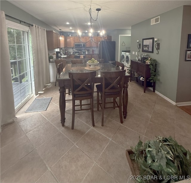 1720 Lakeview Dr, Chillicothe, MO 64601 - dining area featuring a chandelier and light tile patterned floors