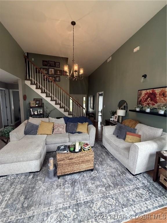 1720 Lakeview Dr, Chillicothe, MO 64601 - living room with stairway, high vaulted ceiling, and a chandelier