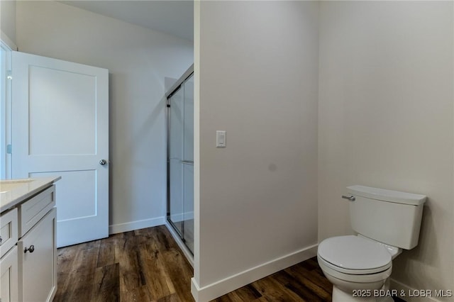 312 Woodland Pt, Linn Creek, MO 65052 - full bathroom featuring vanity, a stall shower, and wood finished floors