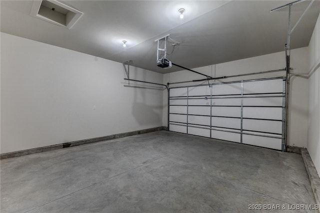 312 Woodland Pt, Linn Creek, MO 65052 - garage with a garage door opener and baseboards