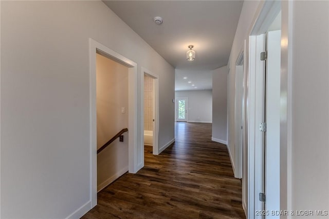312 Woodland Pt, Linn Creek, MO 65052 - hall featuring dark wood finished floors and an upstairs landing