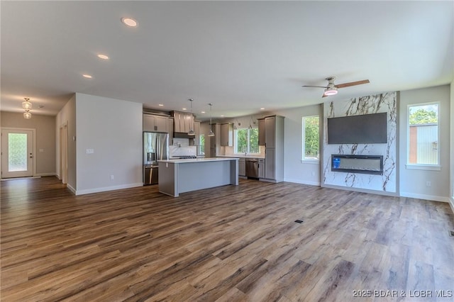 312 Woodland Pt, Linn Creek, MO 65052 - kitchen with open floor plan, gray cabinetry, dark wood-type flooring, and recessed lighting