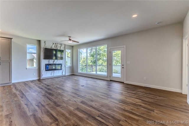 312 Woodland Pt, Linn Creek, MO 65052 - unfurnished living room featuring a ceiling fan, wood finished floors, recessed lighting, and a high end fireplace