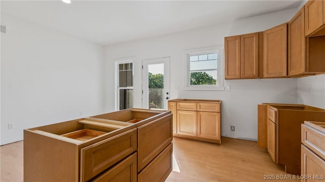 25 Sam Dr, Kaiser, MO 65047 - kitchen featuring light wood-style flooring and recessed lighting