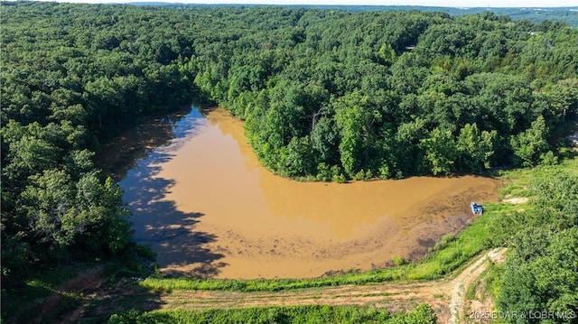 25 Sam Dr, Kaiser, MO 65047 - drone / aerial view of a heavily wooded area