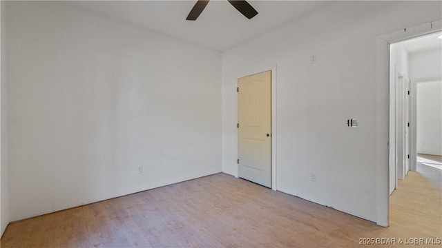 25 Sam Dr, Kaiser, MO 65047 - unfurnished bedroom featuring wood finished floors and a ceiling fan