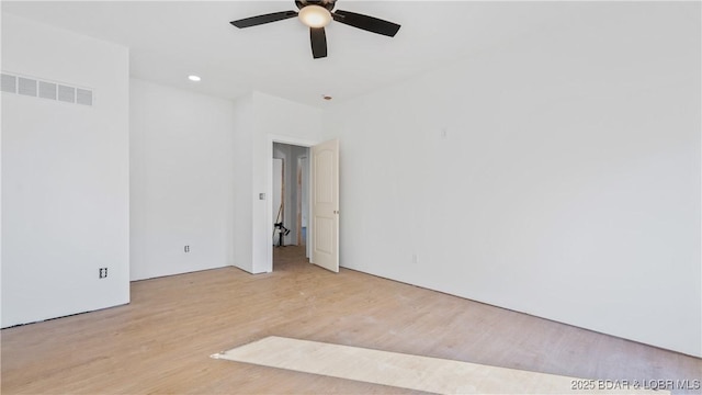 25 Sam Dr, Kaiser, MO 65047 - unfurnished room featuring light wood-type flooring and ceiling fan