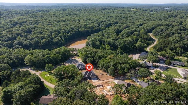 25 Sam Dr, Kaiser, MO 65047 - aerial view of property and surrounding area with a heavily wooded area