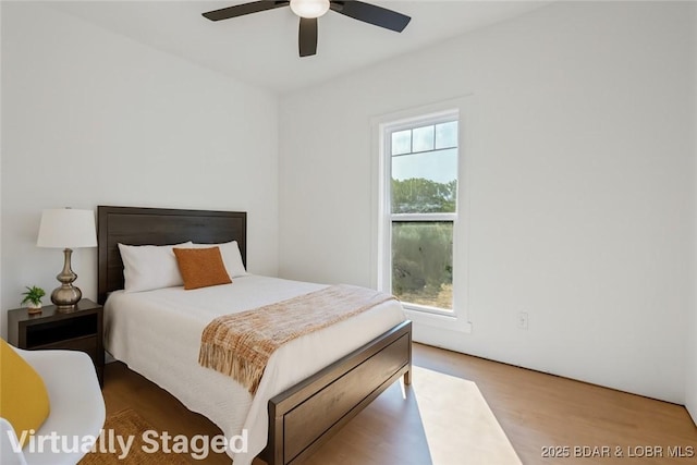 25 Sam Dr, Kaiser, MO 65047 - bedroom with wood finished floors and ceiling fan