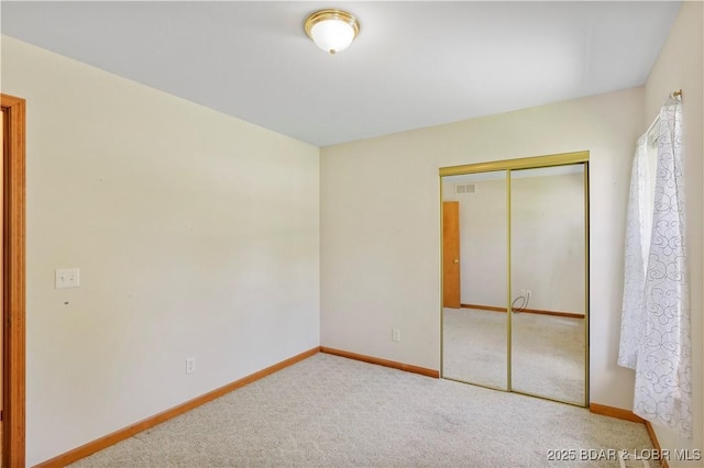 290 Fawn Meadows Dr, Linn Creek, MO 65052 - unfurnished bedroom with a closet and carpet floors
