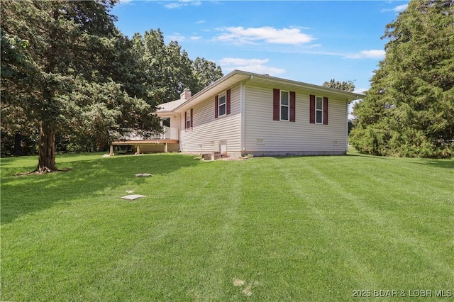 290 Fawn Meadows Dr, Linn Creek, MO 65052 - view of side of property featuring a wooden deck, a yard, and a chimney