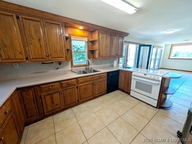 742 Pappys Pt, Sunrise Beach, MO 65079 - kitchen with dishwasher, white electric stove, brown cabinetry, and plenty of natural light