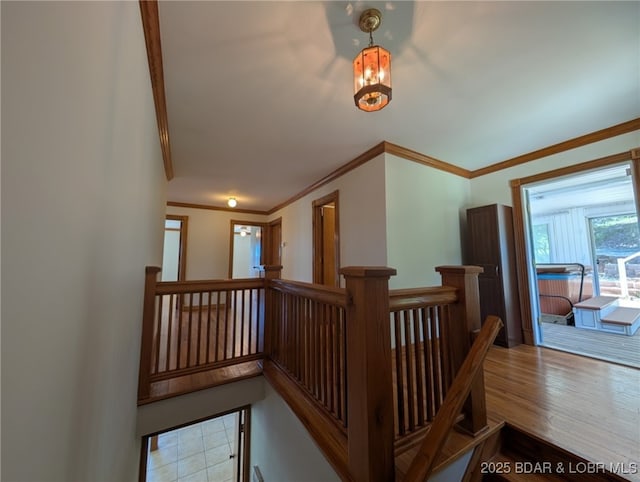 742 Pappys Pt, Sunrise Beach, MO 65079 - hallway with an upstairs landing, crown molding, a chandelier, and wood finished floors