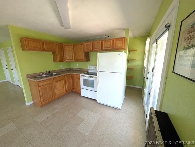 742 Pappys Pt, Sunrise Beach, MO 65079 - kitchen featuring white appliances and light countertops