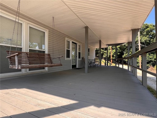 742 Pappys Pt, Sunrise Beach, MO 65079 - wooden terrace with outdoor dining space