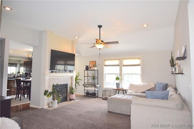 1207 SW 9th St, Oak Grove, MO 64075 - living room with a ceiling fan, a tile fireplace, dark colored carpet, and recessed lighting