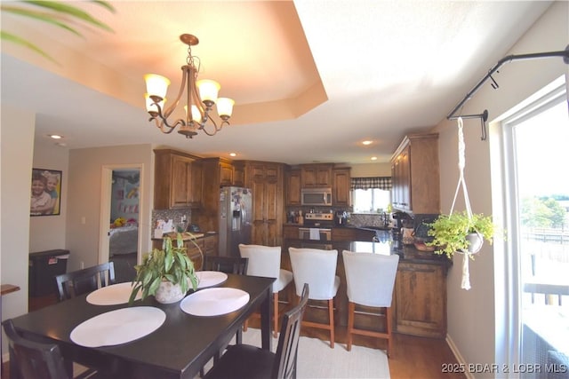 1207 SW 9th St, Oak Grove, MO 64075 - dining area with a chandelier, recessed lighting, and light wood finished floors