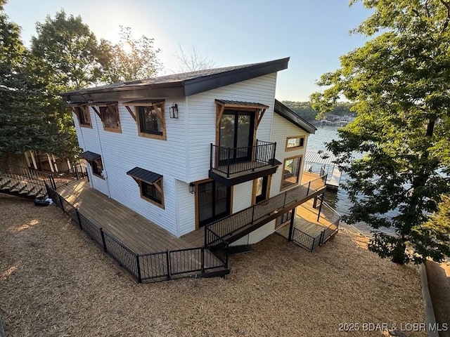 5185 Lois Ln, Osage Beach, MO 65065 - rear view of house featuring a balcony