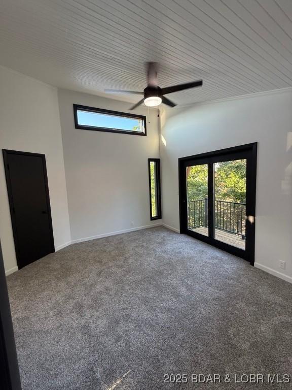 5185 Lois Ln, Osage Beach, MO 65065 - carpeted empty room featuring a ceiling fan and baseboards