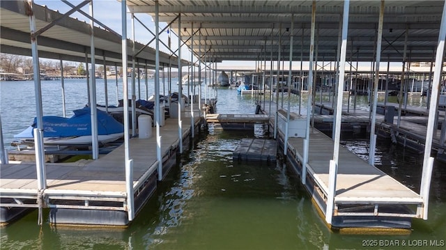 1481 Ledges Dr Unit B14, Osage Beach, MO 65065 - dock featuring a water view and boat lift
