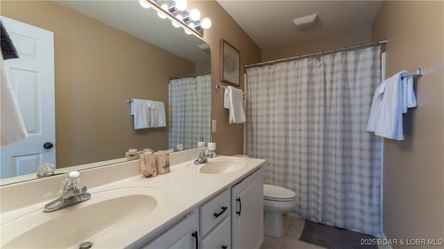 1481 Ledges Dr Unit B14, Osage Beach, MO 65065 - bathroom with double vanity, tile patterned flooring, and curtained shower