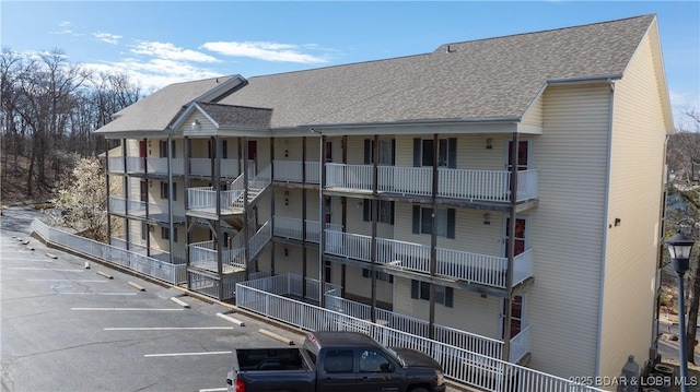 1481 Ledges Dr Unit B14, Osage Beach, MO 65065 - view of apartment building / complex with uncovered parking