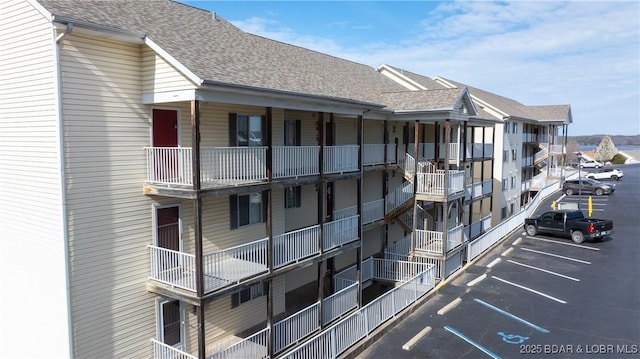 1481 Ledges Dr Unit B14, Osage Beach, MO 65065 - view of apartment building / complex featuring uncovered parking