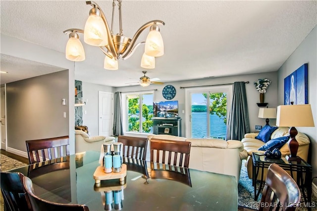 889 Malibu Rd Unit 63, Osage Beach, MO 65049 - dining space with a textured ceiling and a ceiling fan
