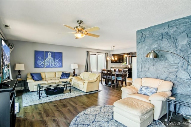 889 Malibu Rd Unit 63, Osage Beach, MO 65049 - living area with a ceiling fan, wood finished floors, a textured ceiling, and healthy amount of natural light