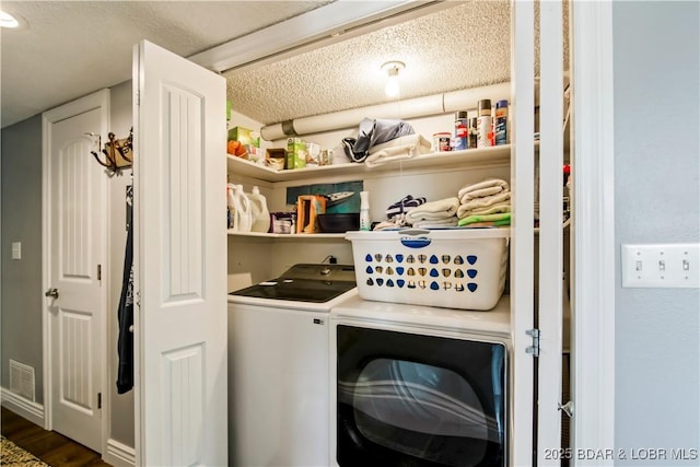 889 Malibu Rd Unit 63, Osage Beach, MO 65049 - washroom with independent washer and dryer, dark wood-style floors, and a textured ceiling