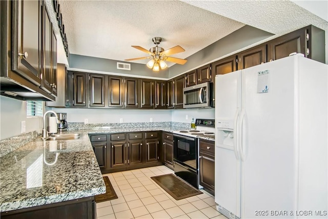 889 Malibu Rd Unit 63, Osage Beach, MO 65049 - kitchen with white appliances, a textured ceiling, dark brown cabinets, ceiling fan, and light tile patterned floors