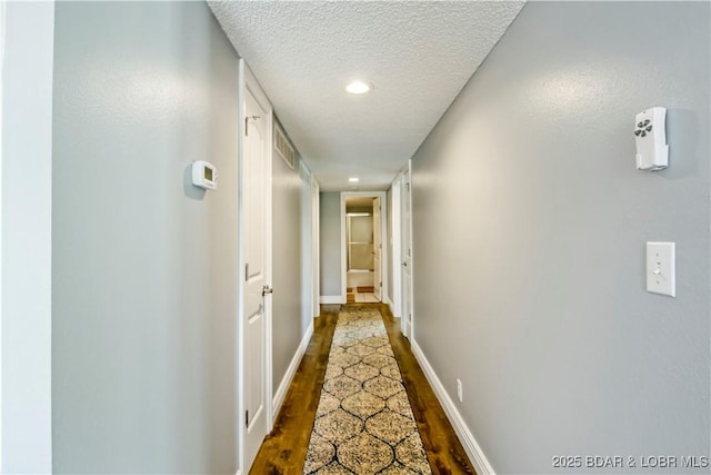 889 Malibu Rd Unit 63, Osage Beach, MO 65049 - hall featuring a textured ceiling, wood finished floors, and recessed lighting