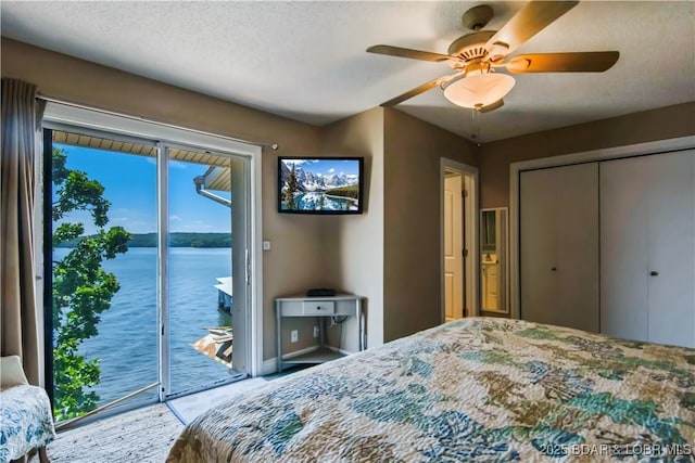 889 Malibu Rd Unit 63, Osage Beach, MO 65049 - bedroom with access to exterior, a ceiling fan, and a closet