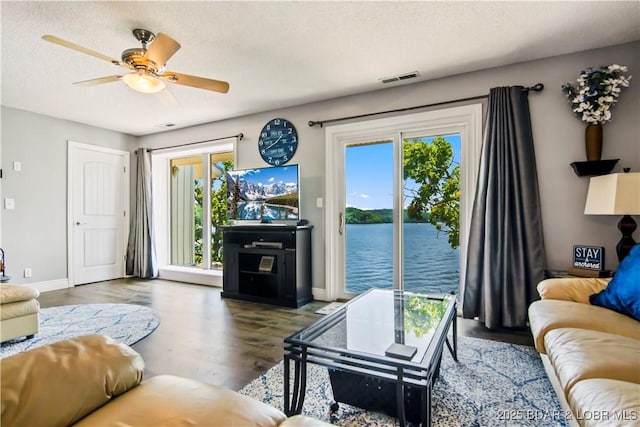 889 Malibu Rd Unit 63, Osage Beach, MO 65049 - living area with wood finished floors and ceiling fan
