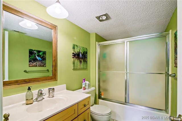 889 Malibu Rd Unit 63, Osage Beach, MO 65049 - bathroom with vanity, a textured ceiling, and enclosed tub / shower combo