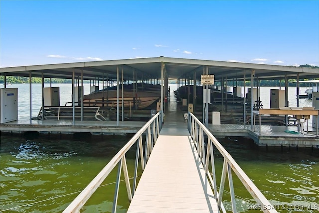 889 Malibu Rd Unit 63, Osage Beach, MO 65049 - dock with boat lift and a water view